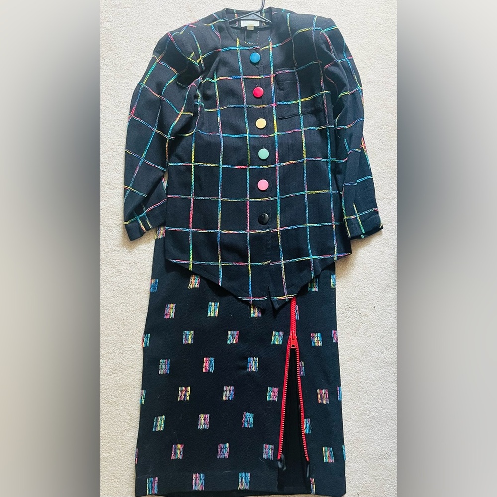 Not available til April

Designer Pat McDonagh Colorful Black jacket and skirt